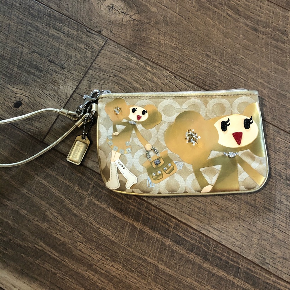 Gold coach wristlet